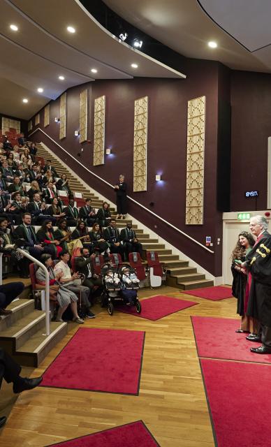 Diploma Ceremony people in conference room