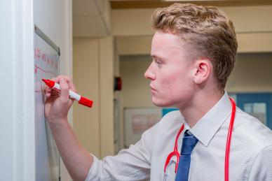 Doctor writing on whiteboard